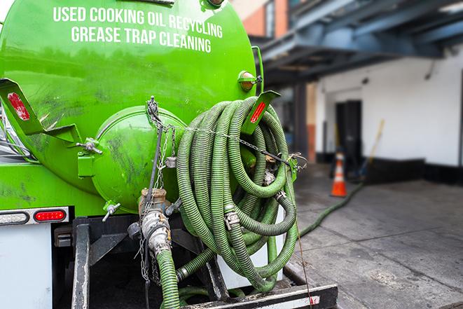 routine grease trap pumping by licensed technician in Ingleside